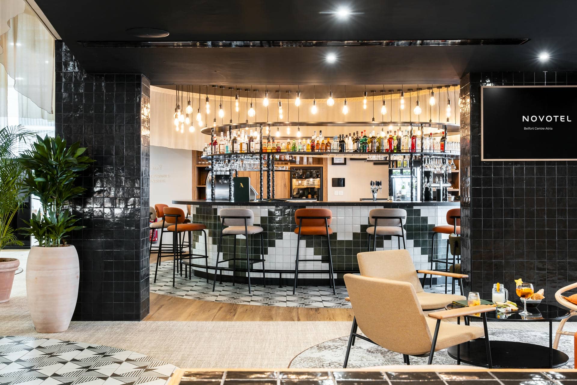 a bar with a sign that says novotel on it