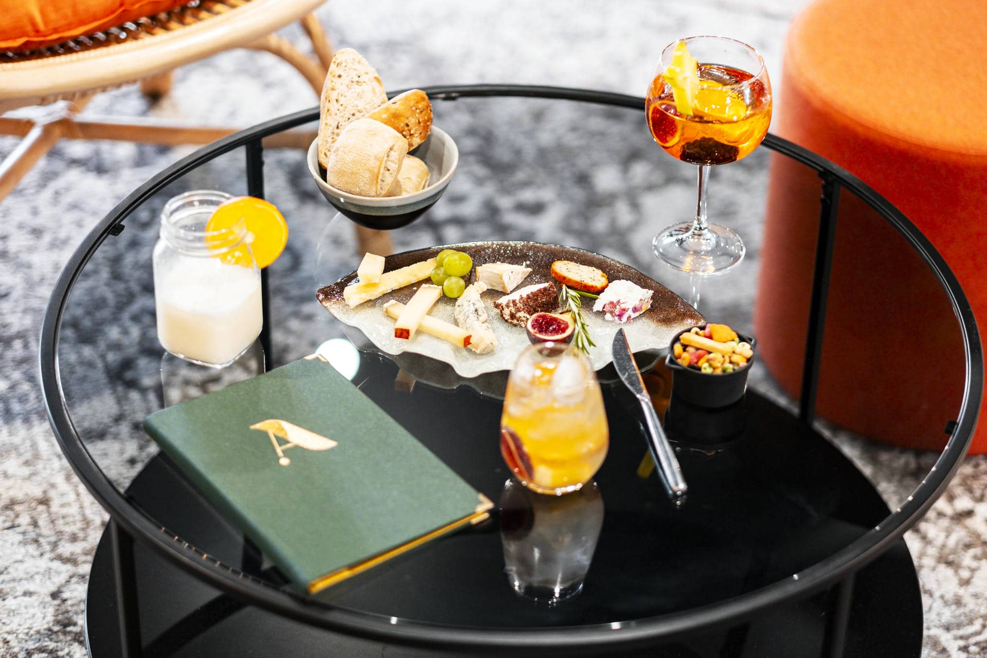 a glass table with food and drinks on it