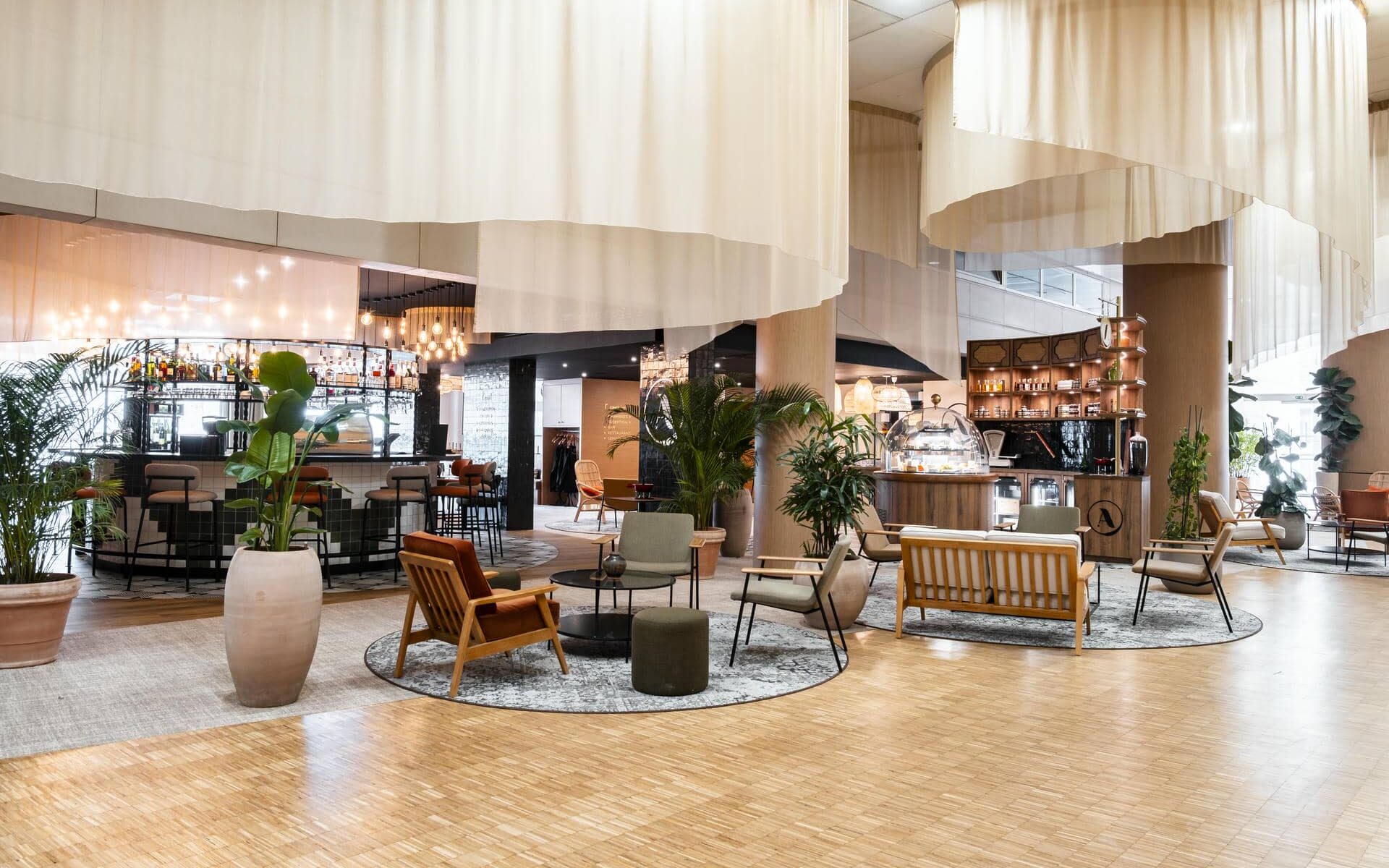 a restaurant with a couch and chairs and a bar