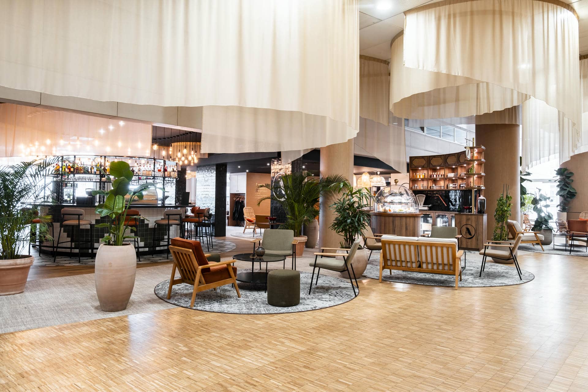 a restaurant with a couch and chairs and a bar