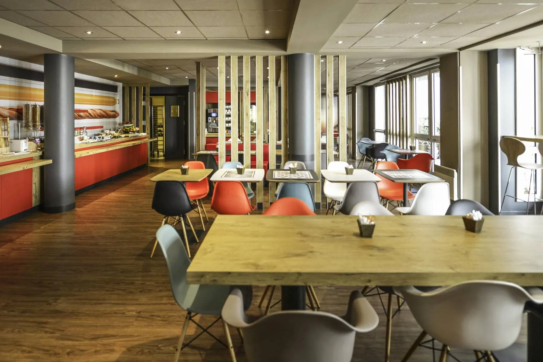 a restaurant with tables and chairs and a buffet