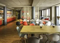 a restaurant with tables and chairs and a buffet