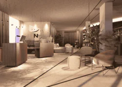 en::Hotel lobby featuring the Novotel “N” logo on the wall, two reception desks, a lounge area with armchairs and a sofa, and a large central bar in the background. fr::Lobby de l’hôtel avec le logo « N » de Novotel sur le mur, deux desks de réception, un espace salon avec fauteuils et canapé, et en arrière-plan un bar central imposant.