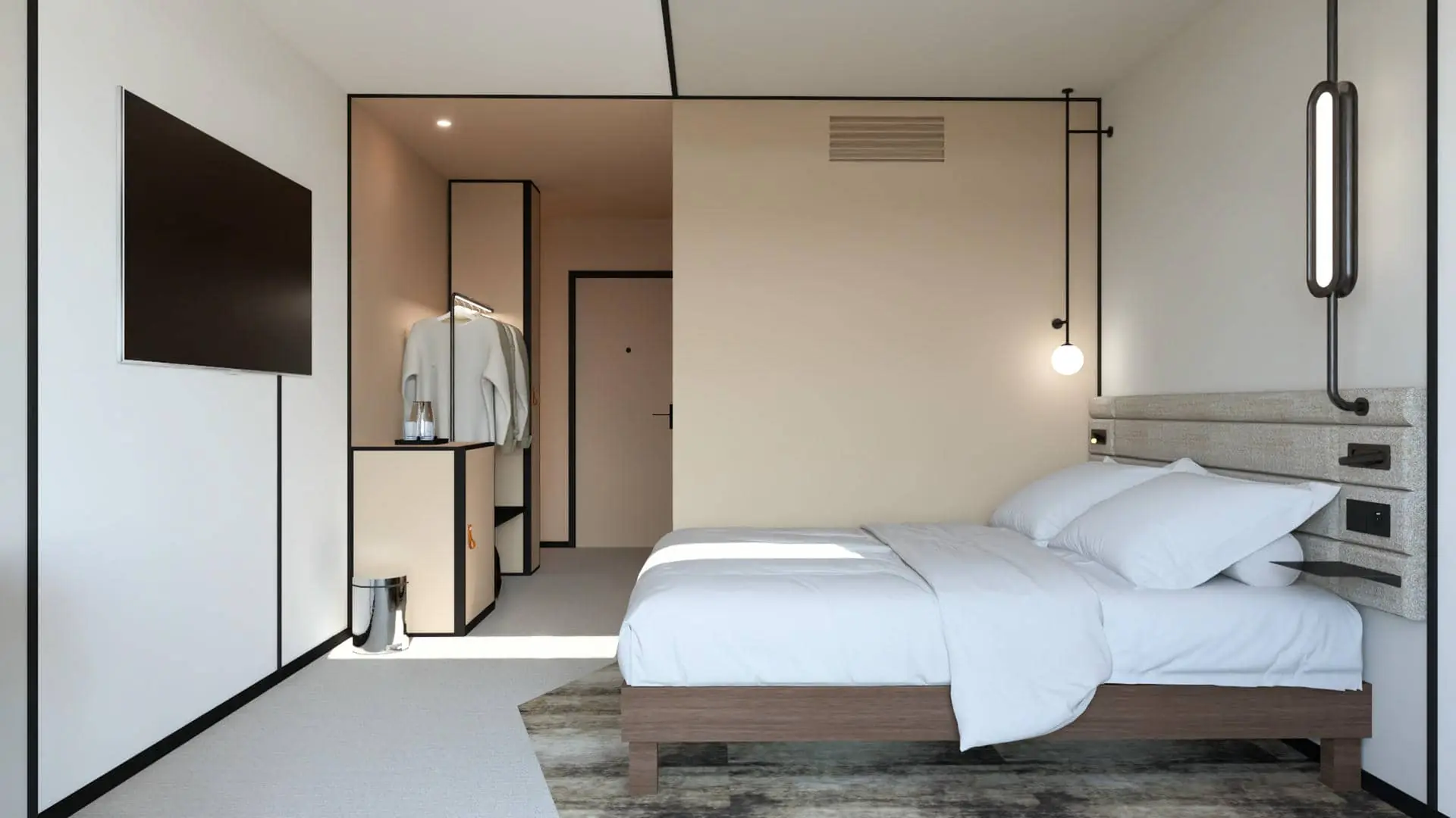 a hotel room with a bed and a flat screen tv