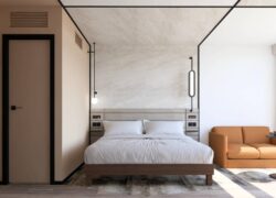 une chambre d'hôtel avec un lit et un canapé