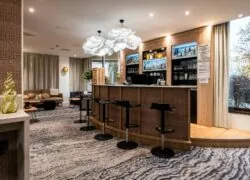 a bar with stools and a sign that says ' a ' on it