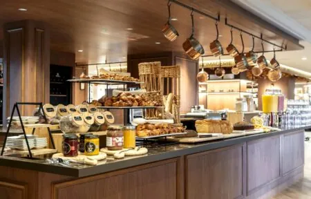 the word fromagerie is on the ceiling above the counter