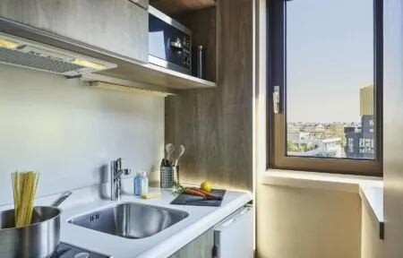 a small kitchen with a sink and a window