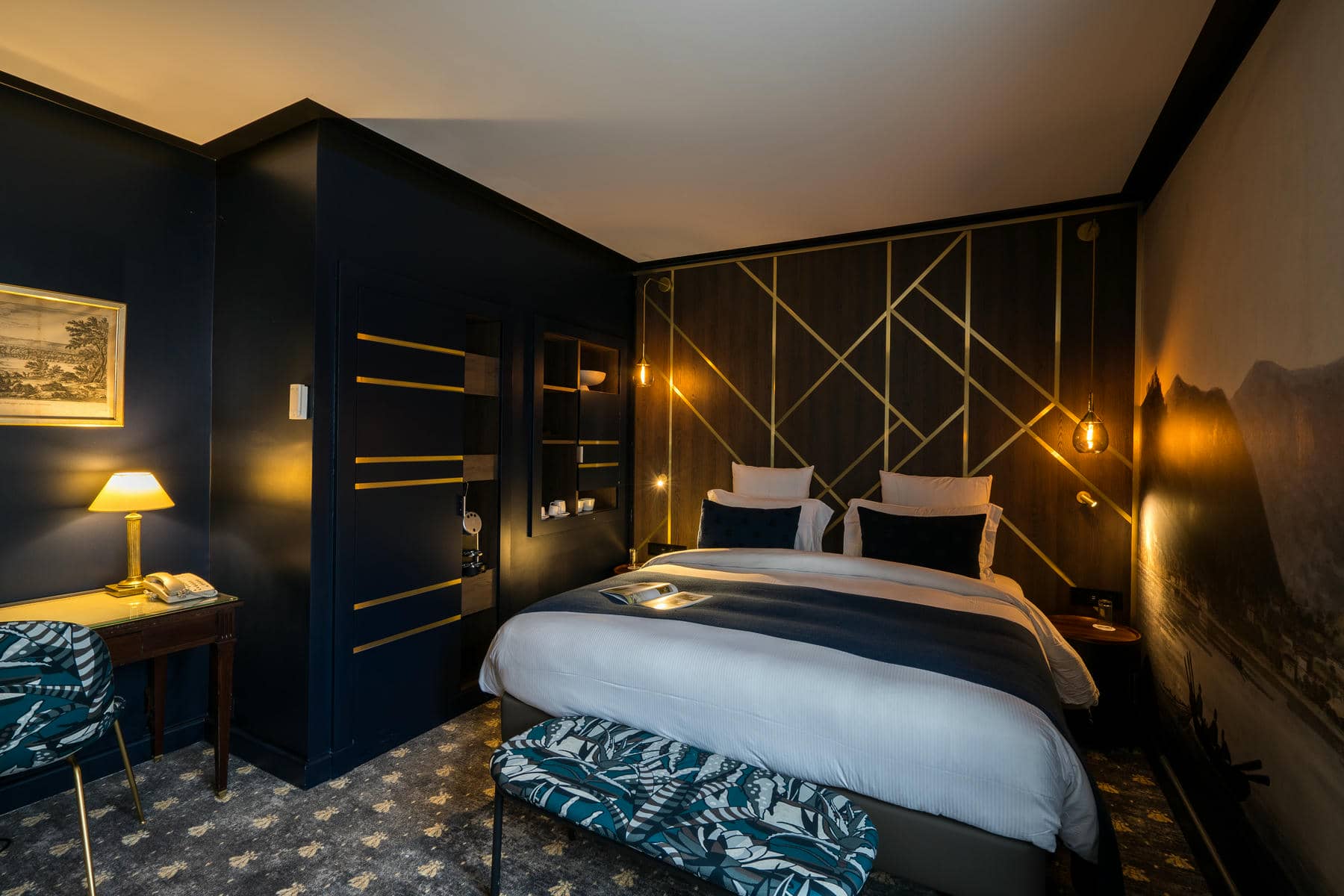 a hotel room with a bed and a desk