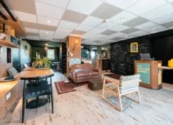 a room with a green sign that says the check-out bookbox