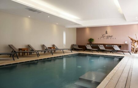 a swimming pool with a sign that says le spa