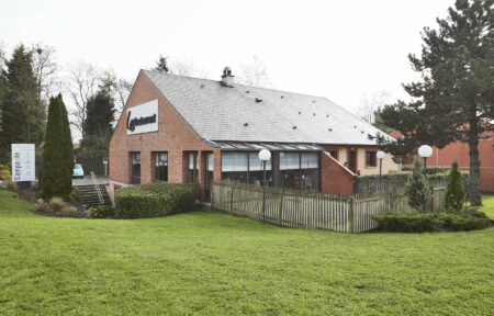 a brick building with a sign that says compagnie