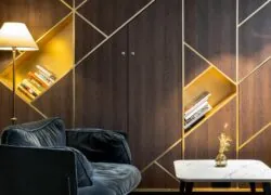 a couch and a table with a vase of flowers on it