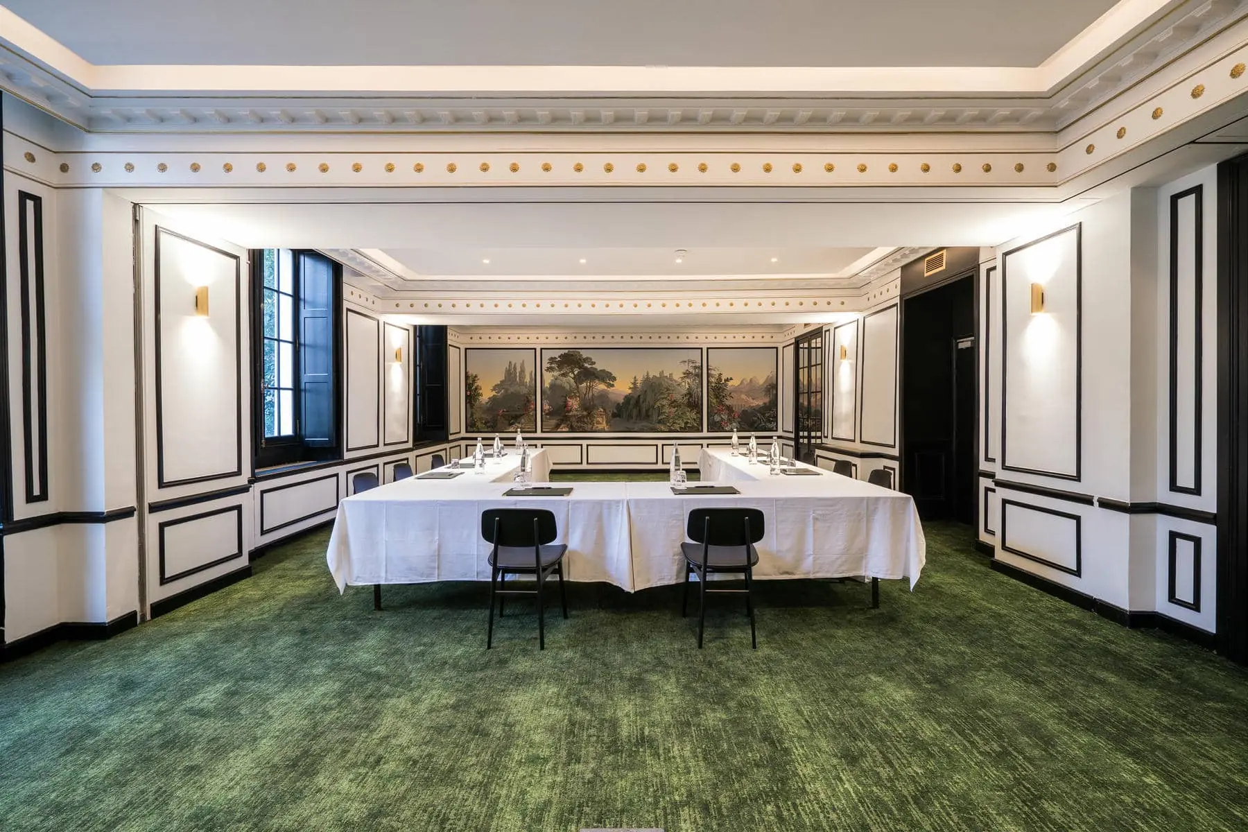 a large room with white tables and chairs