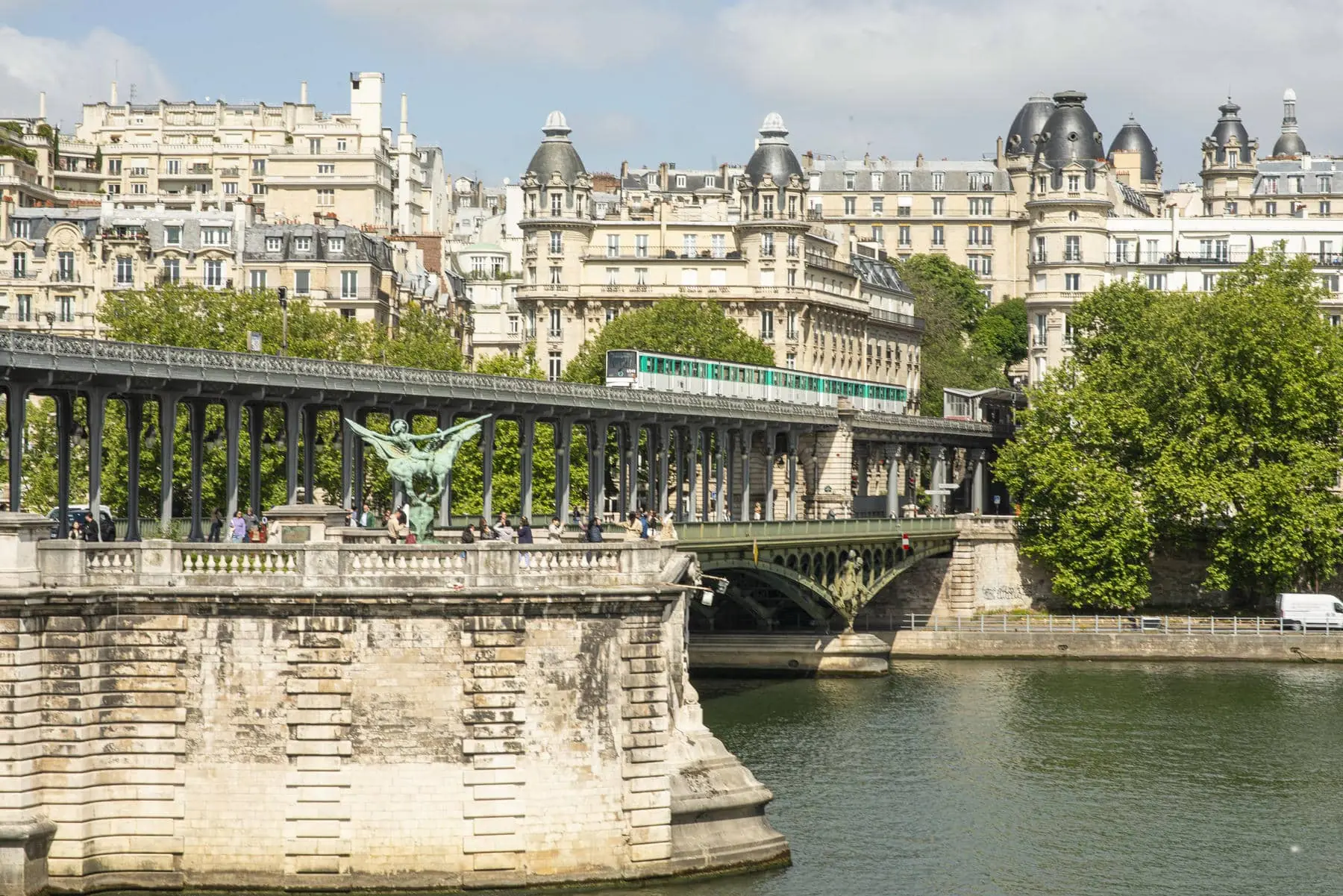 a bridge over a river with a train going over it