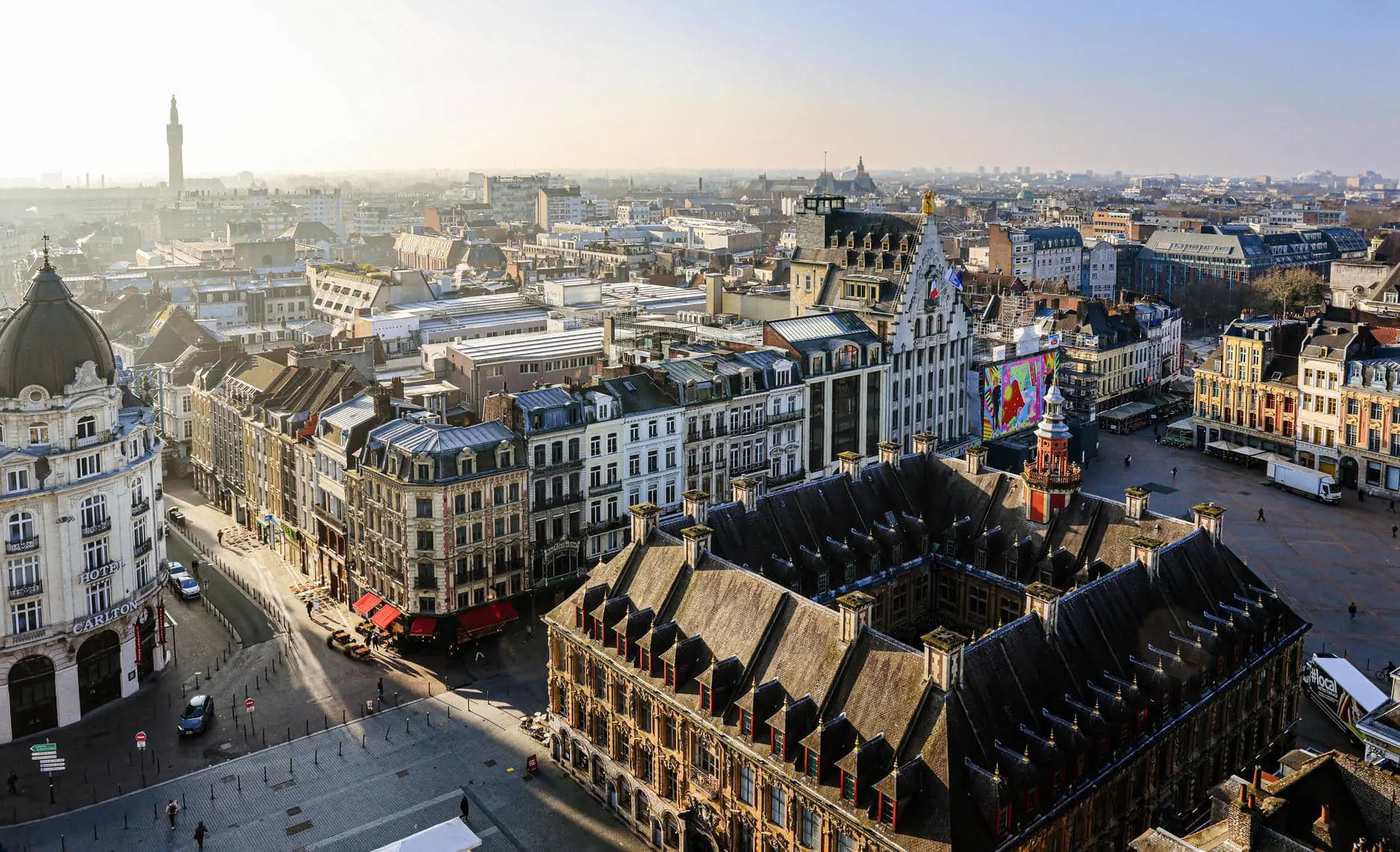 an aerial view of a city with a building that says ' lgp ' on it