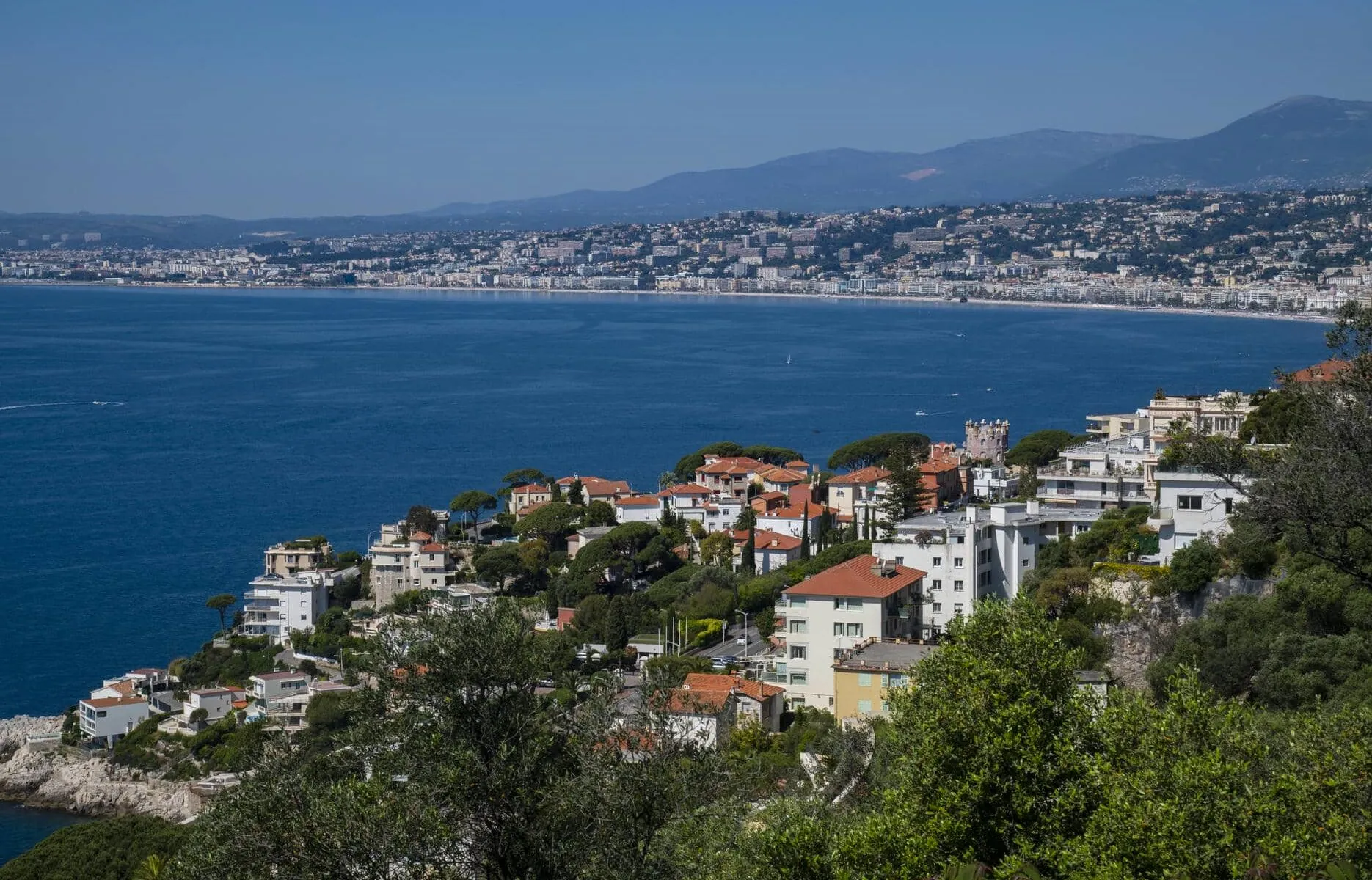 a large body of water with a city in the background