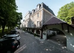 the mercure hotel has a red awning over the entrance