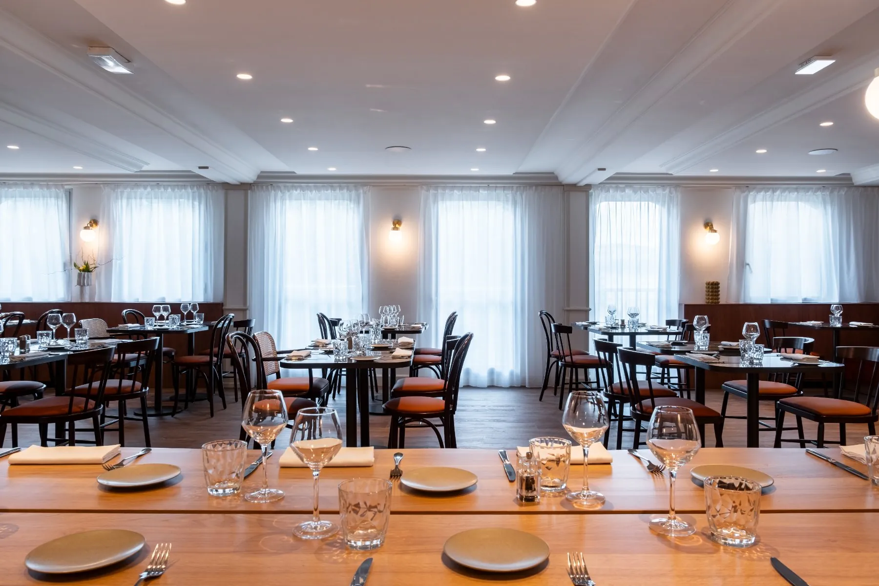 side view of the restaurant dining room, from the communal table looking out across the room