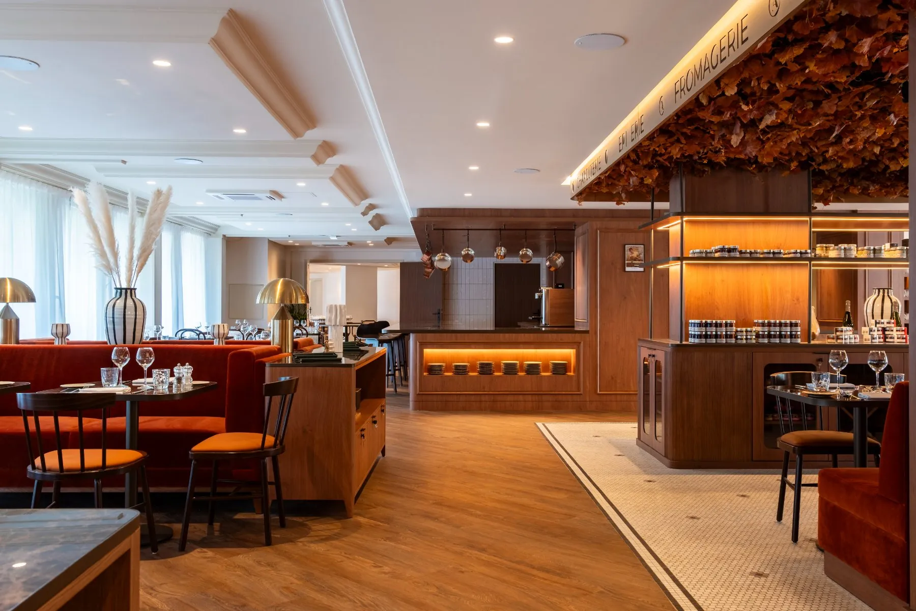 rear view of the restaurant dining room: show-cooking area, buffet, French grocery corner, sofas and set tables