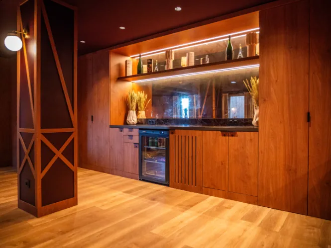 cinema lounge area with a screen, seating, and a dedicated setup for seminar coffee breaks