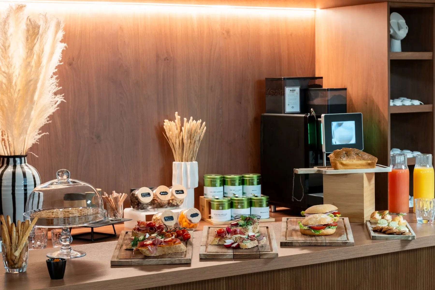 seminar coffee break setup with a selection of savory snacks and drinks in a coffee corner