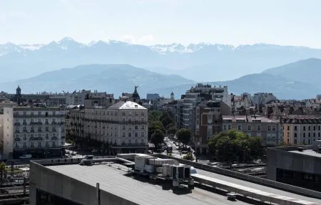 View from the upper floors of the Novotel Grenoble, a 4-star seminar hotel, overlooking the city and the mountains.